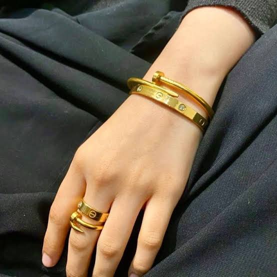 Nail and Cartier bangle with Ring Stack